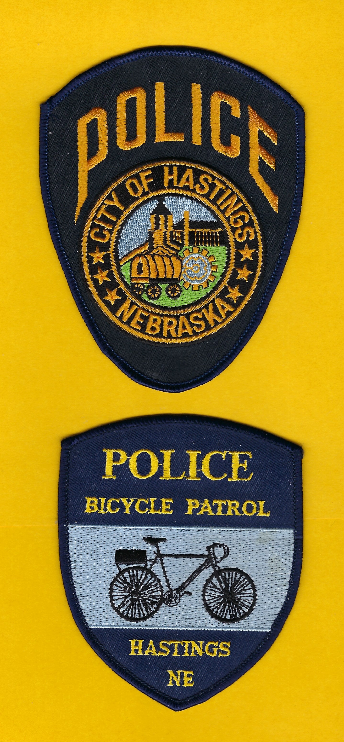 HASTINGS, NEBRASKA POLICE DEPARTMENT BICYCLE PATROL EMBROIDERED PATCH SET BY PUBLIC SAFETY COLLECTIBLES.