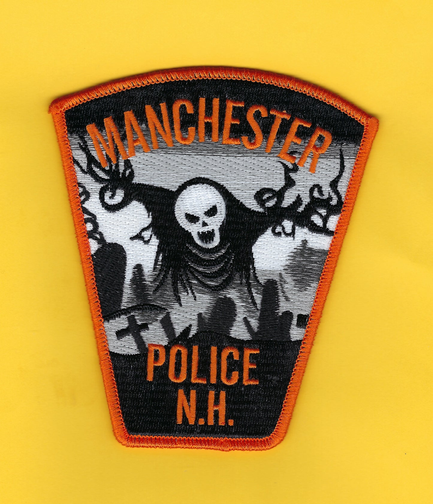 MANCHESTER, NEW HAMPSHIRE POLICE DEPARTMENT 4.75 INCH EMBROIDERED HALLOWEEN PATCH BY GHOST PATCH ENTERPRISES.
