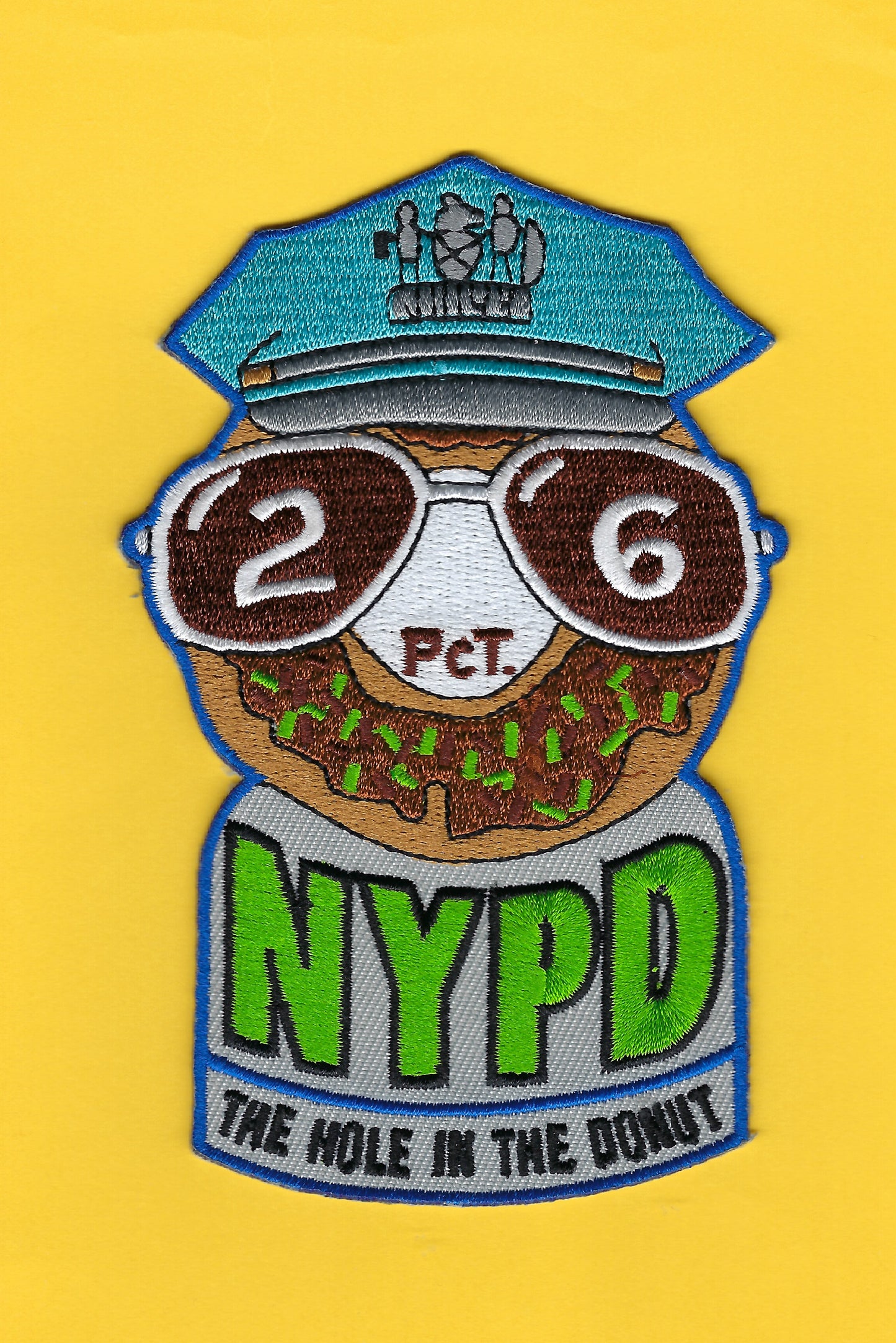 NEW YORK CITY POLICE DEPARTMENT (NYPD) 26TH PRECINCT 'HOLE IN THE DONUT' EMBROIDERED PATCH.