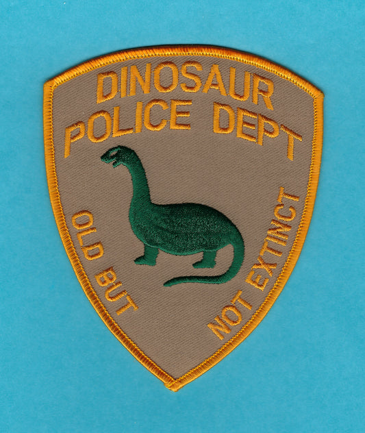 DINOSAUR CITY (FICTIONAL) POLICE DEPARTMENT 5-INCH 'OLD BUT NOT EXTINCT' EMBROIDERED NOVELTY PATCH BY PUBLIC SAFETY COLLECTIBLES.