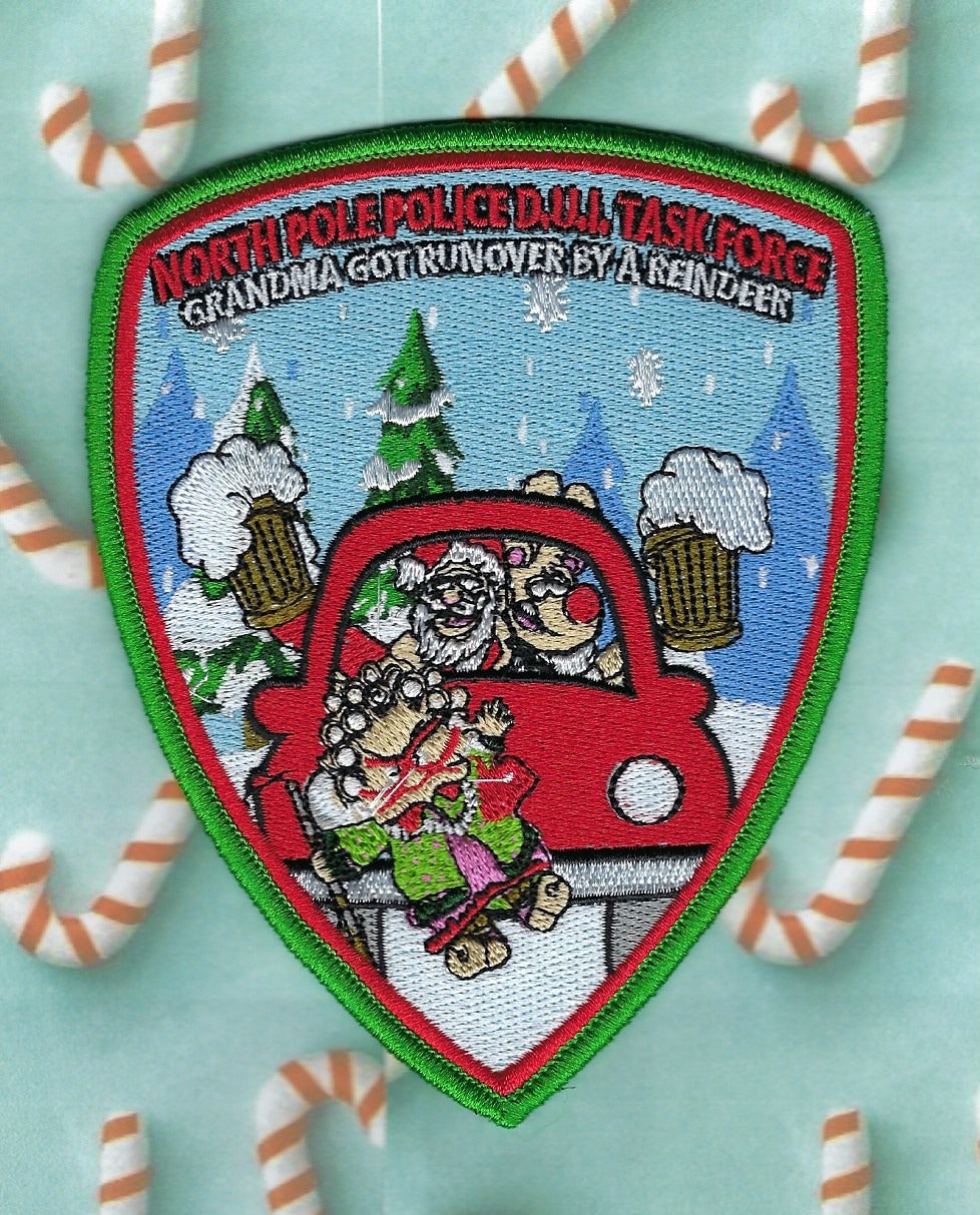 NORTH POLE, ALASKA POLICE DEPT 'DUI TASK FORCE' EMBROIDERED PATCH DESIHGNED AND PRODUCED BY UNDERDOG PATCH PRODUCTIONS.