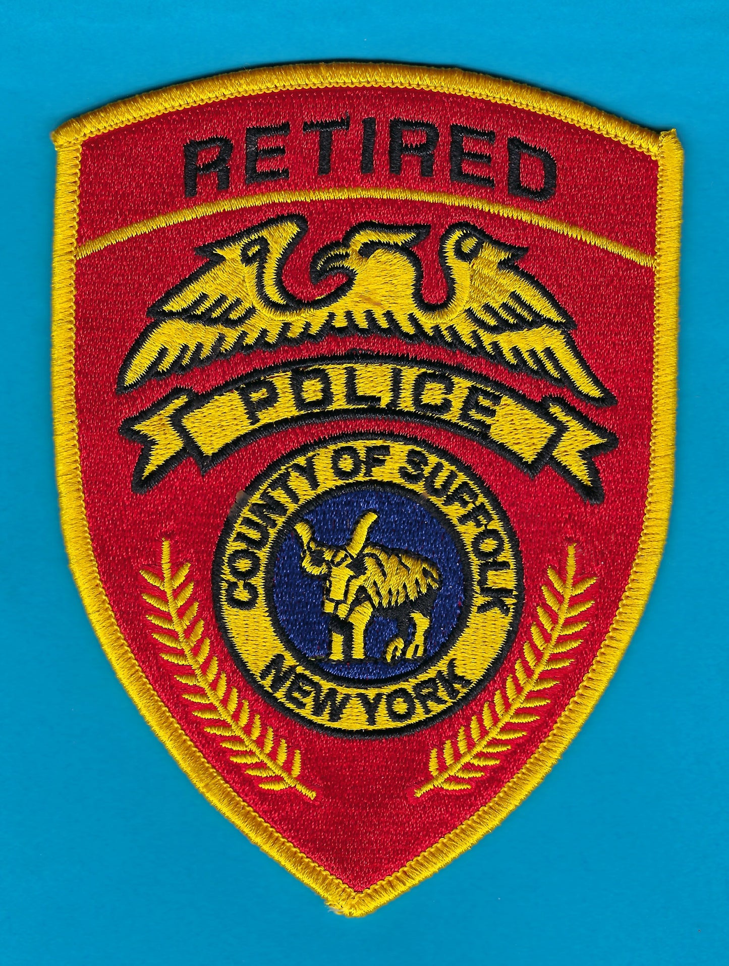 SUFFOLK COUNTY, NEW YORK POLICE DEPARTMENT (SCPD) 'RETIRED OFFICER' EMBROIDERED PATCH BY REAL TIME COIN CENTER.